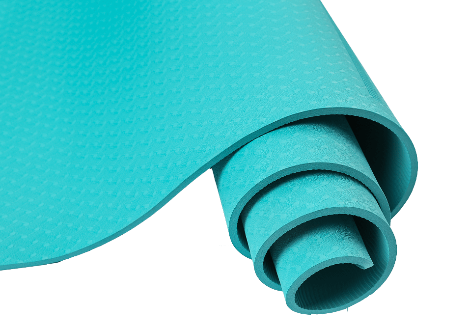JOINFIT Blue Yoga Mat rolled up showing non-slip textured surface and vibrant blue color.