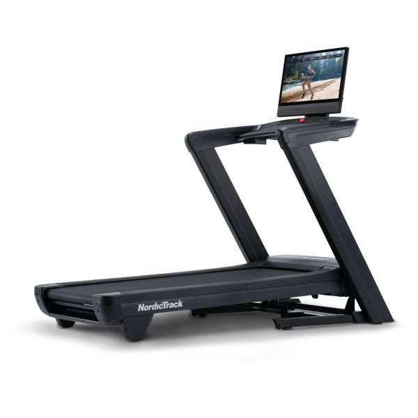NordicTrack Commercial 2450 treadmill with a black metal frame, wide running belt, and large pivoting touchscreen display.